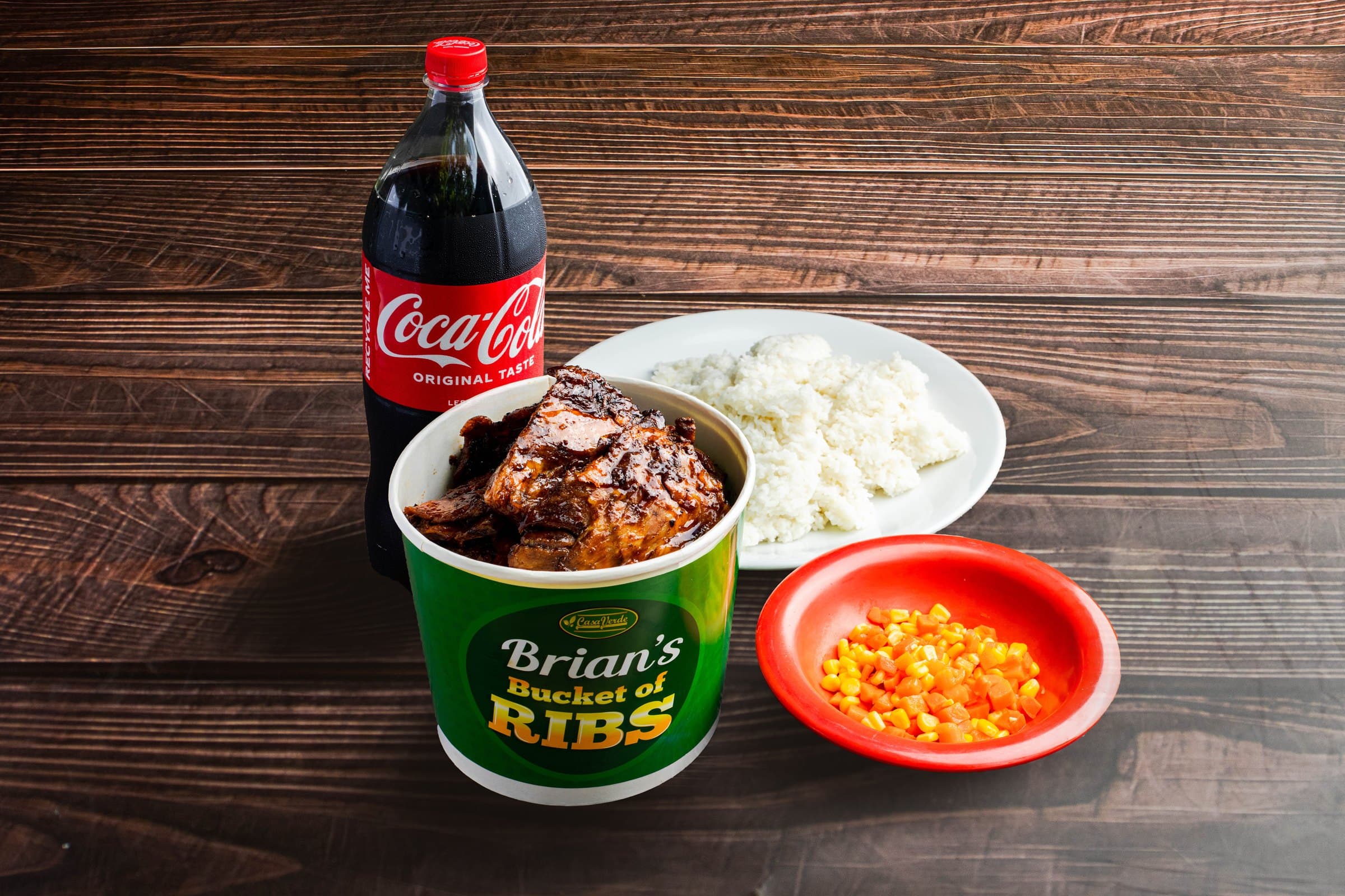 Hero: Brian's Ribs or a full-table spread that includes Brian's Ribs — real dish, real serving size, warm light