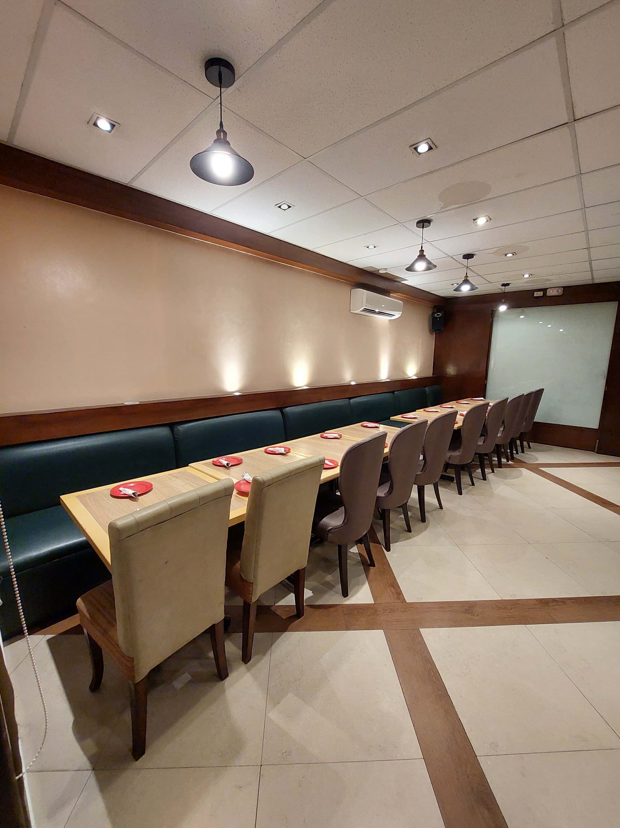 The Ramos function room, set for a celebration — long table, place settings ready